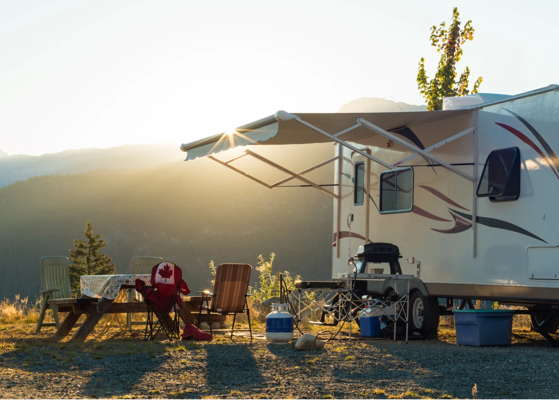 White recreational vehicle parked up at sunset