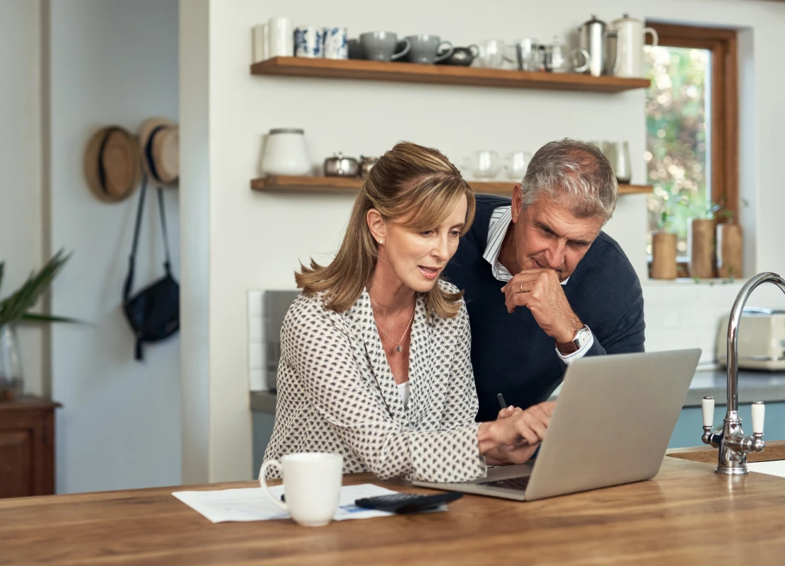 two people on laptop